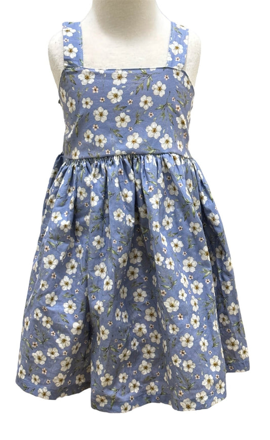 The front of a blue floral summer dress with an elasticised back on a mannequin.